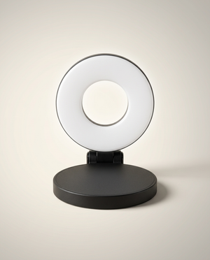 Fliq MagSafe Light Pro snapped onto phone warm light filming setup